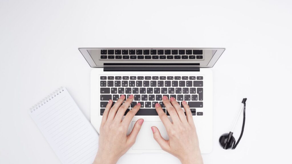 Top view desk concept with woman hands
