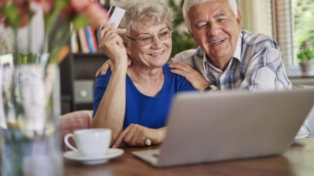 Senior couple doing shopping online