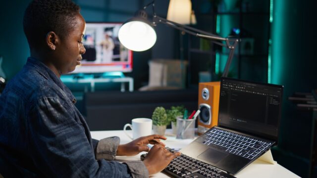 Teleworker using laptop to do coding for software developing