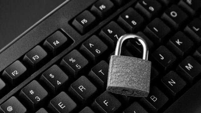 Top view of a lock on a black computer keyboard