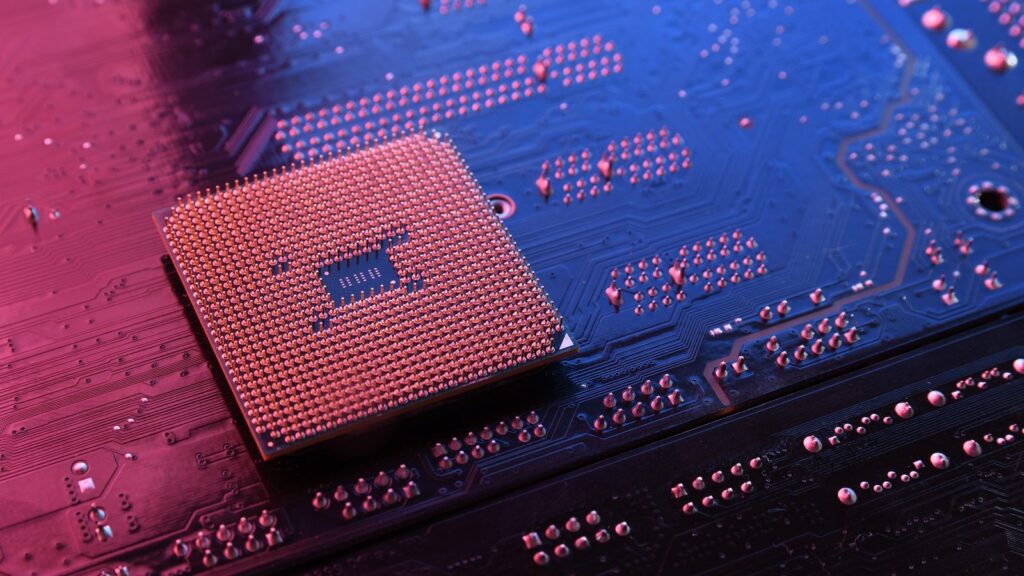 Computer cpu processor chip on circuit board ,motherboard background. Close-up. With red-blue lighting