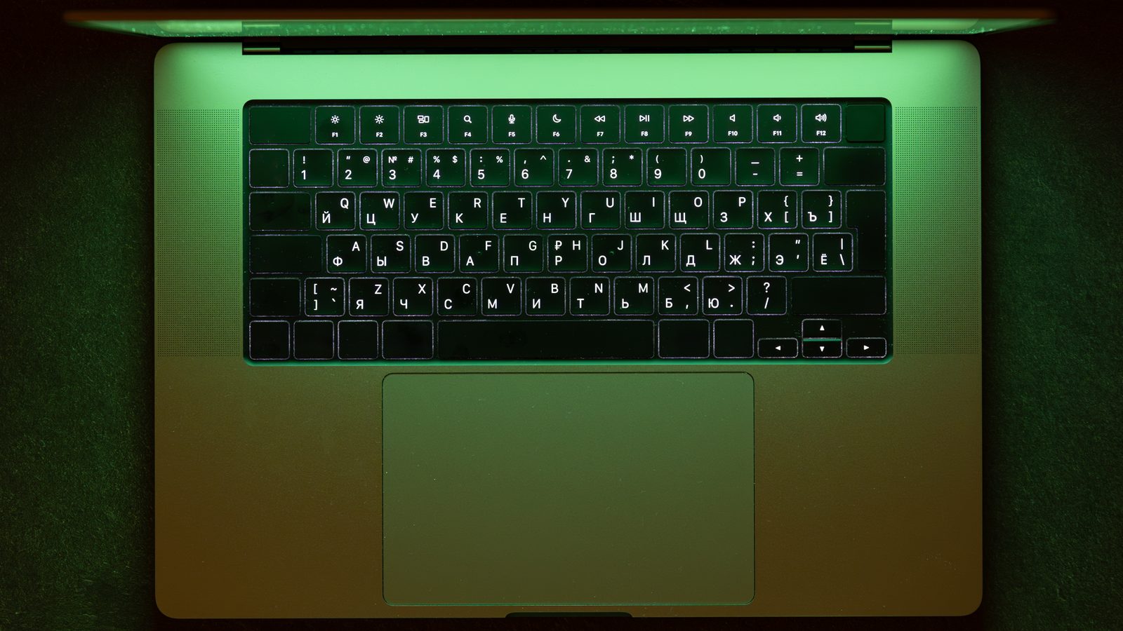 Laptop in green neon for coding and data eco tech work