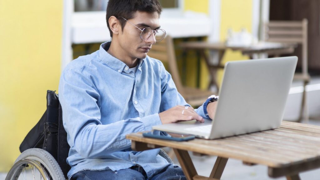 Medium shot man working on laptop