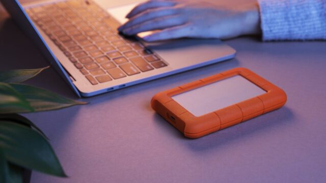 Close up hands typing on laptop